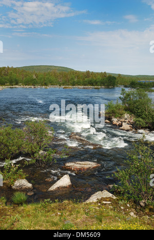 Swift wide river in the Finnish taiga forest Stock Photo