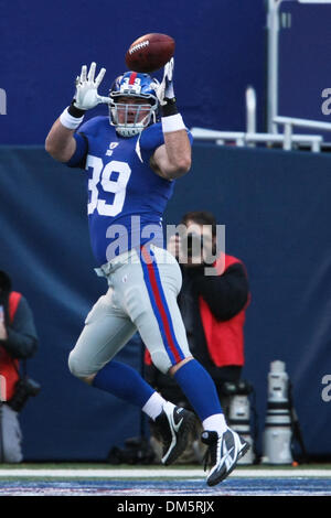 New York Giants' Madison Hedgecock (39) gets stuffed by Carolina Panthers'  Damione Lewis (92), Darwin Walker (93), Jon Beason (52) and Chris Gamble  (20) during the second quarter on Sunday, December 21