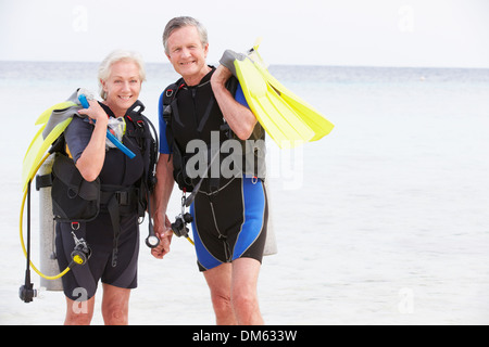 Senior Couple With Scuba Diving Equipment Enjoying Holiday Stock Photo