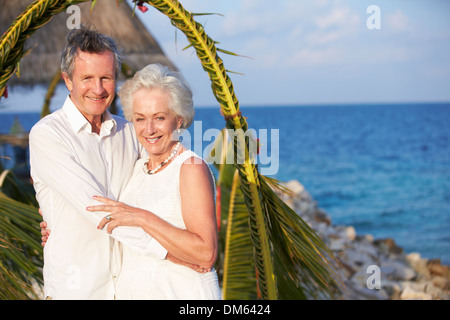 Senior Couple Getting Married In Beach Ceremony Stock Photo
