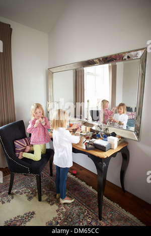 Two Girls Playing With Jewelry And Make Up Stock Photo