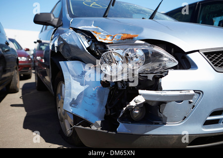 Loss Adjuster Inspecting Car Involved In Accident Stock Photo