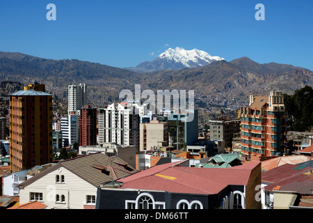 Illimani Glacier, 6,439 m, at front the skyscrapers of La Paz, Departamento La Paz, Bolivia Stock Photo