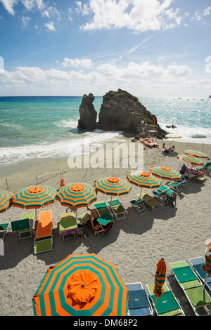 Sandy beach and colorful sunshades, Monterosso al Mare, Cinque Terre, La Spezia Province, Liguria, Italy Stock Photo