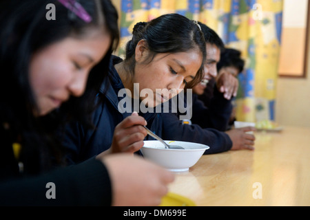 Teenagers eating in the cafeteria of their school, El Alto, Department of La Paz, Bolivia Stock Photo