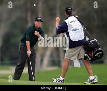 Mar 03, 2005; Miami, FL, USA; PHIL MICKELSON tosses his ball to his caddie after making a bogey on the 10th hole.  Mickelson finished the first round at 8 under par Stock Photo