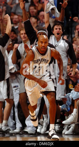 Jan 04, 2005; San Antonio, TX, USA; BRUCE BOWEN runs back to defense as his teammates on the bench celebrate another of his three point baskets in the second half. Bowen led all players with 24 points in the Spurs 100-83 win. Stock Photo