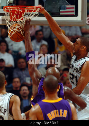 Jan 04, 2005; San Antonio, TX, USA; TIM DUNCAN follows through on an alley-oop over the Lakers LAMAR ODOM in the second half  against the Los Angeles Lakers at the SBC Center in San Antonio. The Spurs won the game 100-83. Stock Photo