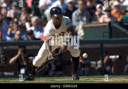 Apr 05, 2005; San Francisco, CA, USA; MLB Baseball. San Francisco Giants Marquis Grissom lays down a bunt in the 8th inning which score one run breaking the tie on a throwing error by Los Angeles Dodgers pitcher Giovanni Carrara at SBC Park on Tuesday April 5, 2005  Mandatory Credit: Photo by Paul Kitagaki Jr./Sacramento Bee/ZUMA Press. (©) Copyright 2005 by Sacramento Bee Stock Photo