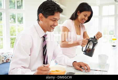 Man Having Breakfast Before Going To Work Stock Photo