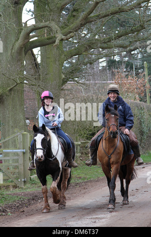 Horses and riders hacking out Stock Photo