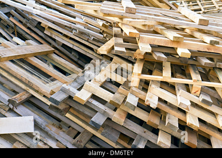 background of piled up in a pile of wooden pallets Stock Photo