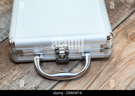 Close up view of closed steel case on wooden timber Stock Photo