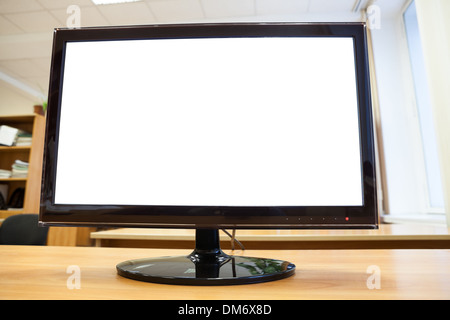 Black monitor with isolated screen standing on an office desk Stock Photo