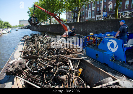 Removing bicycles from the canals in Amsterdam Stock Photo