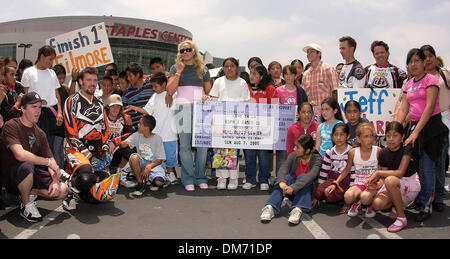 June 15, 2005; Los Angeles, CA, USA; X Games athletes and students from the 10th Street Elementary School gather around the first ticket to ESPN's X Games 11 during the ESPN X GAMES 11 KICKOFF event at Staples Center. Mandatory Credit: Photo by Vaughn Youtz/ZUMA Press. (©) Copyright 2005 by Vaughn Youtz. Stock Photo