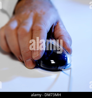 Hand on mouse Stock Photo