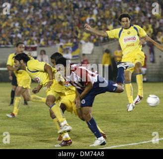 Aug 10, 2005; LOS ANGELES, CALIFORNIA, USA; Over 88,000 fans get ready to watch 'Coors Light Te Trae el Clasico de Clasicos' (Coors Light Brings You the Classic of Classics) between Mexico's two most popular soccer teams the Club Deportivo Chivas del Guadalajara and Club America at the Los Angeles, Memorial Coliseum. Players in action during the game. Club America won the game 2 to Stock Photo