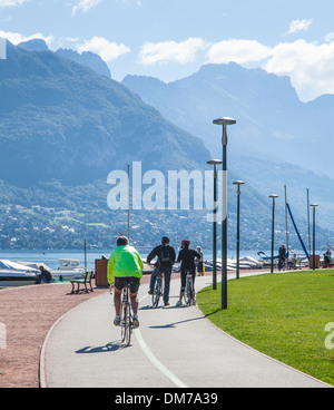 Cycling path and cyclists around Lake Annecy, Savoie, France Stock Photo