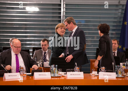 Berlin, Germany. December 12th, 2013. Chancellor Merkel and Interior Minister Friedrich meet with the Prime Ministers of the Germany Federal states at the Chancellery in Berlin. / Picture: Angela Merkel, German Chancellor, and Guido Westerwelle, German Foreign Minister. Credit:  Reynaldo Chaib Paganelli/Alamy Live News