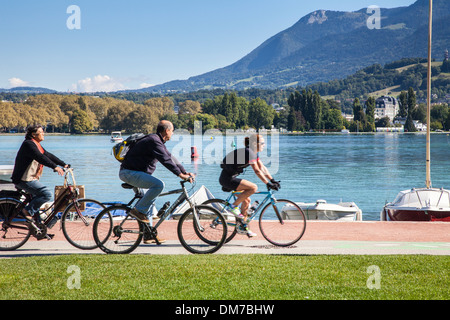 Cycling path and cyclists around Lake Annecy, Savoie, France Stock Photo