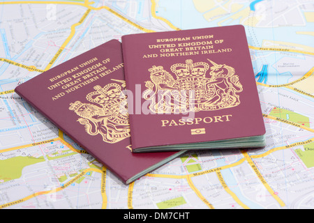 Two United Kingdom Passports On A Map Stock Photo