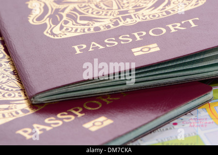 Close up Of Two United Kingdom Passports On  A Map Stock Photo