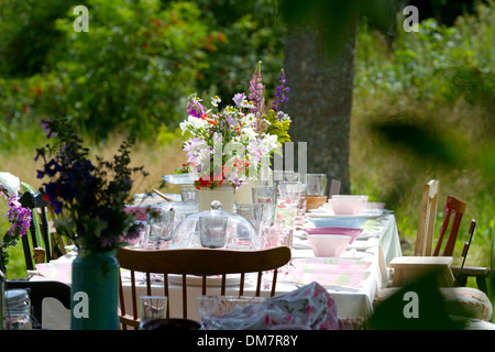 Outdoor table setting at midsummer Stock Photo