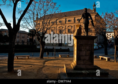 Sunset at statue of Vandelvira with town hall (Palacio de las Cadenas) on the background, Ubeda, Jaen province, Andalusia, Spain Stock Photo