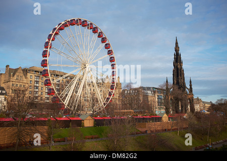 Big wheel and Scott Monument in Edinburgh city centre Stock Photo