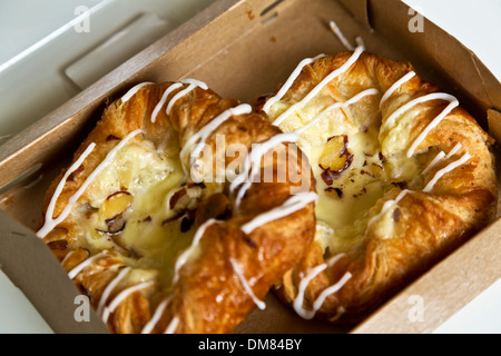 Box of vanilla creme crown Danish pastry Stock Photo