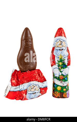 Wrapped chocolate figures of santa Claus isolated over white background with clipping path. Stock Photo