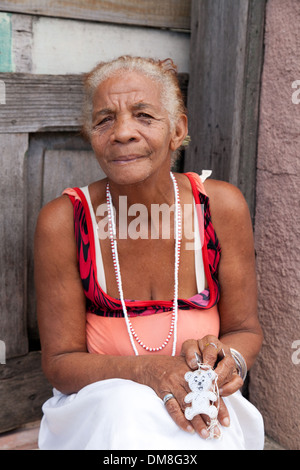 Old Cuban lady sitting on her doorstep, Cienfuegos, Cuba caribbean Stock Photo