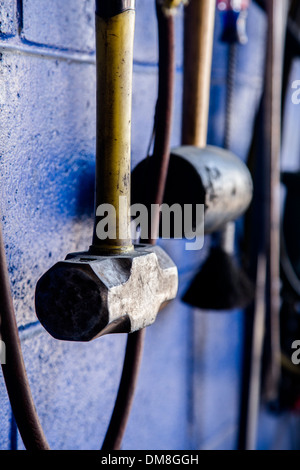 Hammer hanging on wall Stock Photo