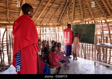 Maasai children at English lecture in the Ngorongoro Conservation Area in the Crater Highlands area of Tanzania Eastern Africa Stock Photo