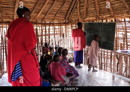 Maasai children at English lecture in the Ngorongoro Conservation Area in the Crater Highlands area of Tanzania Eastern Africa Stock Photo