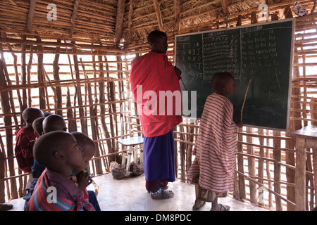 Maasai children at English lecture in the Ngorongoro Conservation Area in the Crater Highlands area of Tanzania Eastern Africa Stock Photo