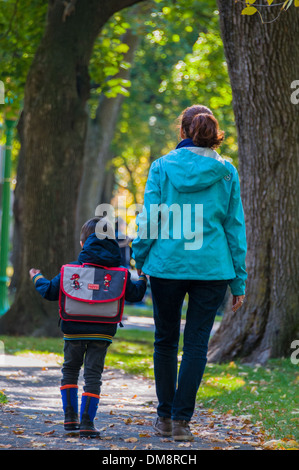 Mother and child on their way to school Stock Photo