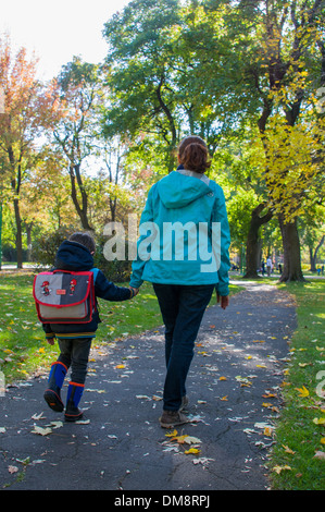 Adult and child walking Stock Photo