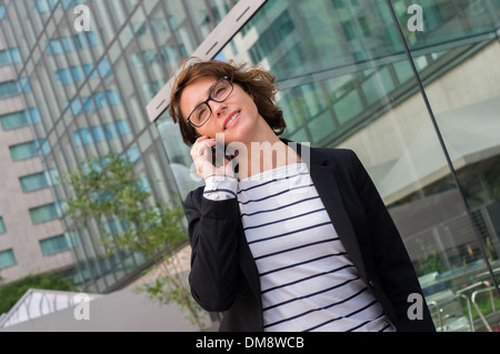 Woman talking on cellular Stock Photo
