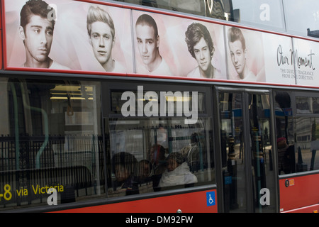 One direction 'Our Moment Fragrance' Advertisement on a London Red Bus Stock Photo