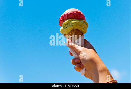 Gelati ice cream cone held up to the hot summer sky Stock Photo