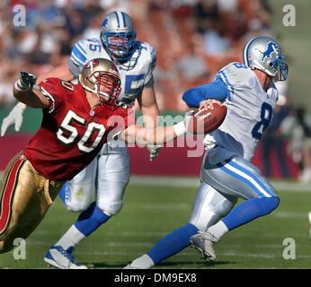 SAN FRANCISCO - 11/04/01 - San Francisco 49ers vs Detroit Lions - LILB Derek Smith of San Francisco reaches for the ball as Lions QB Mike McMahon evades him  during the first half. In background is Lions RT Matt Joyce. Sacramento Bee/Bryan Patrick  /ZUMA Press Stock Photo