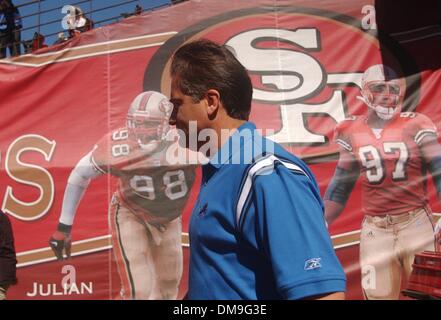 Former San Francisco 49ers head coach Steve Mariucci walks past images of current players as he enters the field of play before the football game between the San Francisco 49ers and Detroit Lions Sunday, Oct. 5, 2003 at the Park at Candlestick Point in San Francisco, California. Sacramento Photograph by Jose Luis Villegas October 5, 2003  /ZUMA Press Stock Photo