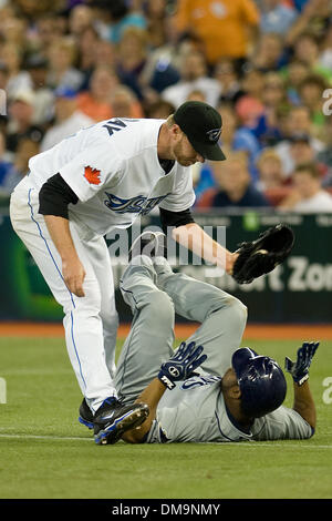 24 August 2009: Toronto Blue Jays starting pitcher Roy Halladay #32 puts the tag on Tampa Bay Rays second baseman Willy Aybar #16 at the Rogers Centre in Toronto in a game between the Tampa Bay Rays and the Toronto Blue Jays..The Tampa Bay Rays won 12-7..*****FOR EDITORIAL USE ONLY* (Credit Image: © Southcreek Global/ZUMApress.com) Stock Photo