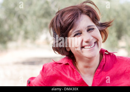 Happy grandmother in field Stock Photo