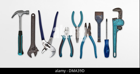 A set of isolated used hand tools all with blue handles Stock Photo