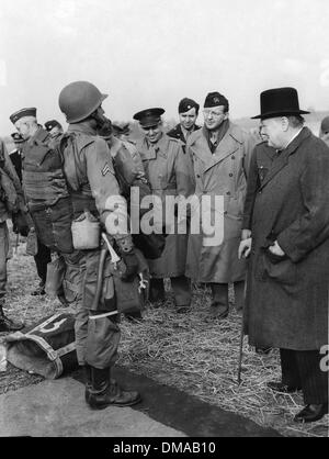 Mar. 23, 1952 - London, England, U.K. - SIR WINSTON CHURCHILL (1874-1965) was a British politician and statesman who served as Prime Minister of the United Kingdom. PICTURED: Churchill inspects glider and paratroopers of the U.S. Army 'Somewhere in England' accompanied by President Dwight D. Eisenhower. (Credit Image: © KEYSTONE Pictures USA) Stock Photo