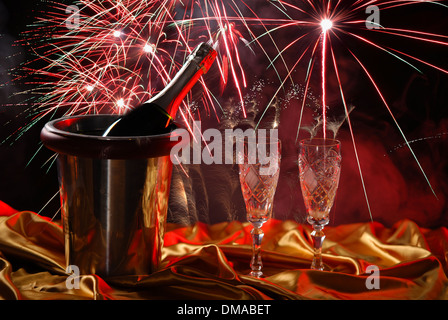 pouring champagne and fireworks on a dark background Stock Photo