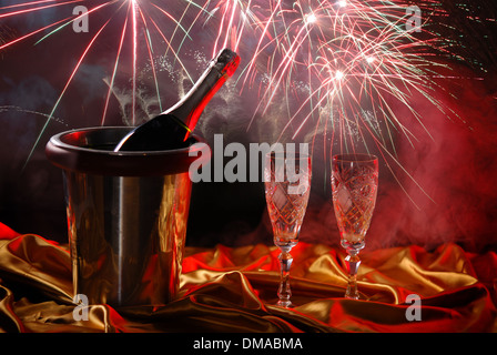 pouring champagne and fireworks on a dark background Stock Photo